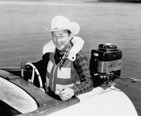 Roy Rogers with Mercury outboard motor in boat